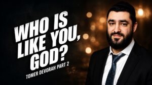 Promotional thumbnail showing a bearded man in a suit on the right and bold white title 'Who is like you, God?' on the left.